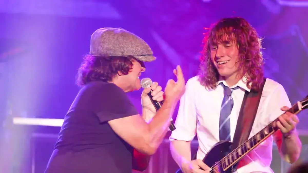 Dirty Deeds: The AC/DC Experience on stage with the Angus Young schoolboy uniform and full lighting rig