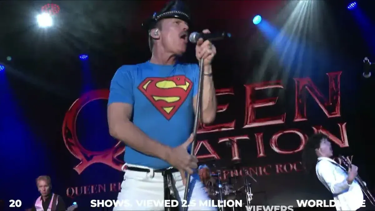 Queen Nation singer Gregory Finsley performing live in front of the Queen Nation backdrop