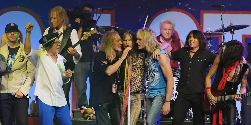 David Victor on stage with Steven Tyler of AEROSMITH at the Boston Strong Benefit Concert in 2013